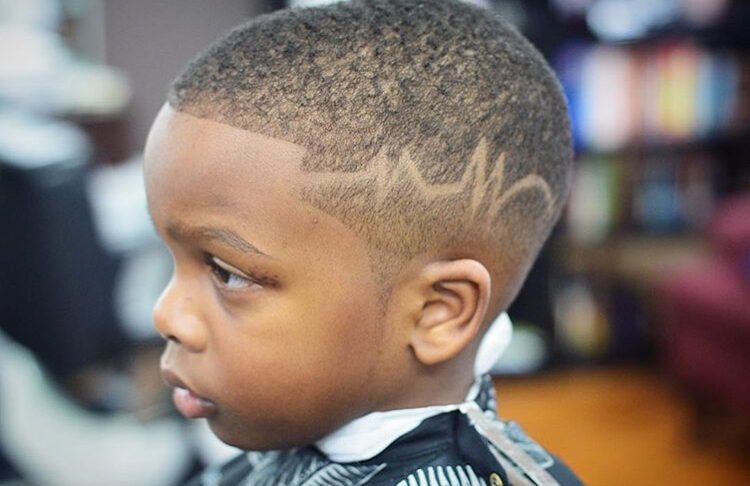 Kids fade with hair design side profile